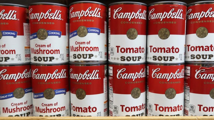 cans of campbells soup sit on a shelf in a grocery store on news photo 1046599136 1542810801